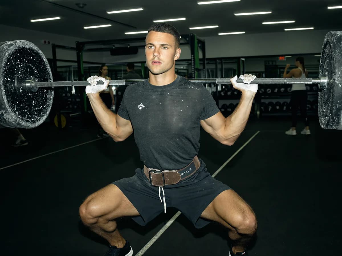 Athlete performing a barbell back squat